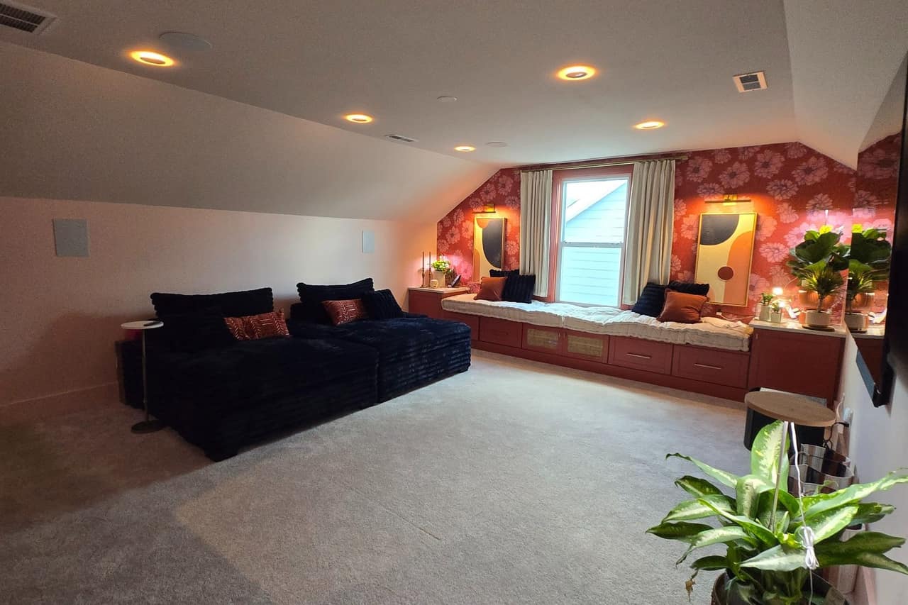 A finished bonus room with a custom built-in window seat, new carpet and recessed lighting